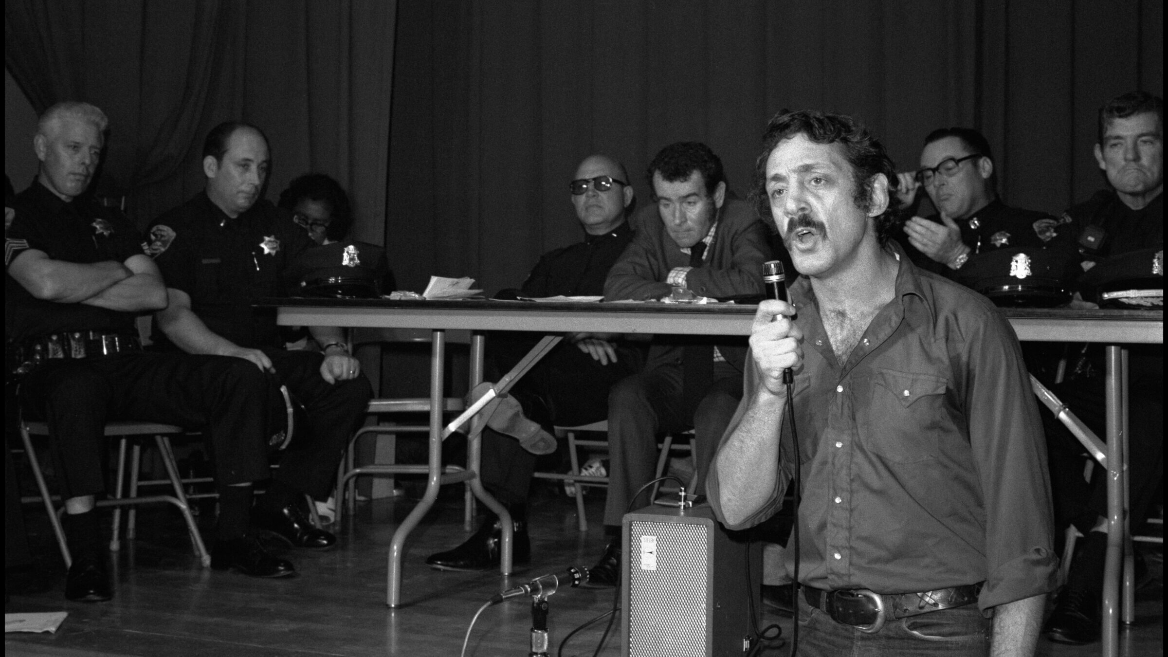  Harvey Milk speaks during a Police Community Relations meeting in San Francisco, 1974.
