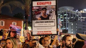 A poster of hostage Jonathan Samerano is seen at a demonstration calling for the release of Israeli hostages held by Palestinian terrorists after the Oct. 7 attack, near Azrieli Mall in Tel Aviv, Oct. 24, 2023. (Ahmad Gharabli/AFP via Getty Images)