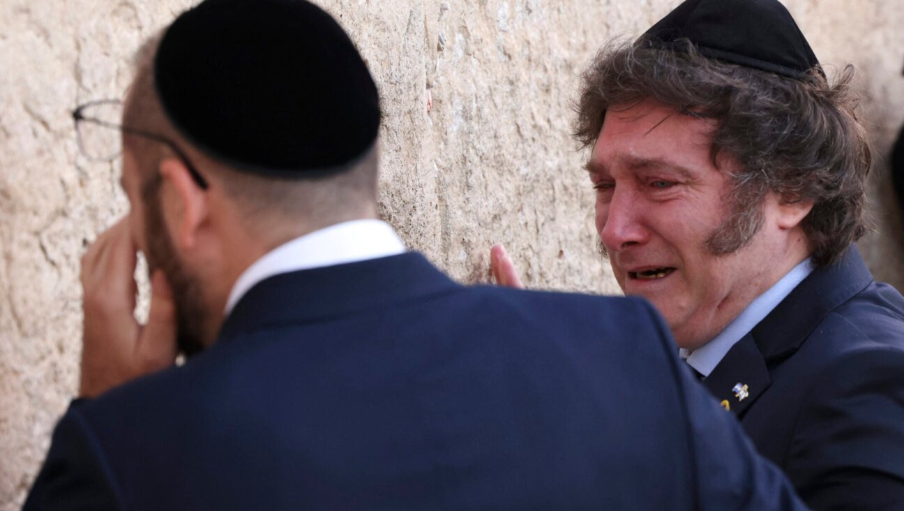 Argentina’s President Javier Milei (R) cries with Rabbi Shimon Axel Wahnish during a visit to the Western Wall in Jerusalem’s Old City on February 6, 2024. (Ronald Schemidt/AFP via Getty Images)