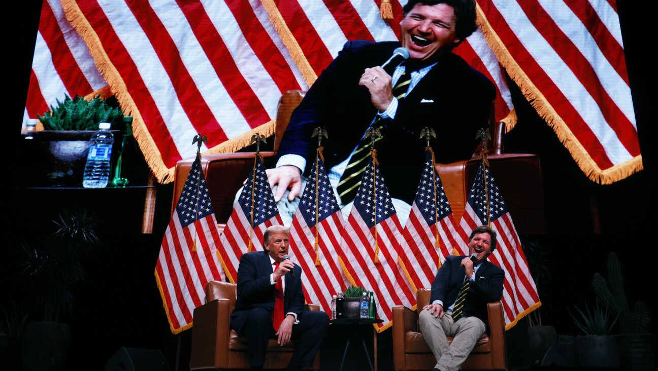 President Donald Trump sits down for a conversation with Tucker Carlson during his Live Tour at the Desert Diamond Arena on October 31, 2024.