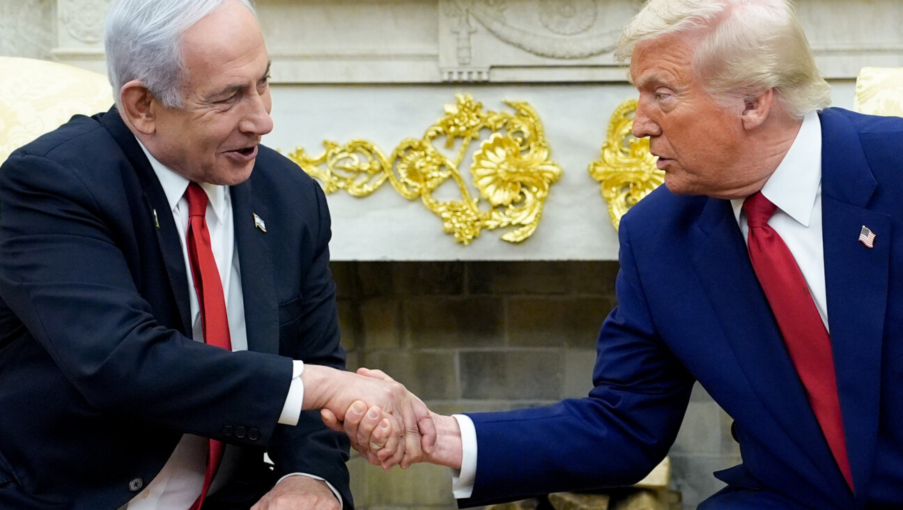 Donald Trump and Benjamin Netanyahu shake hands in the Oval Office.