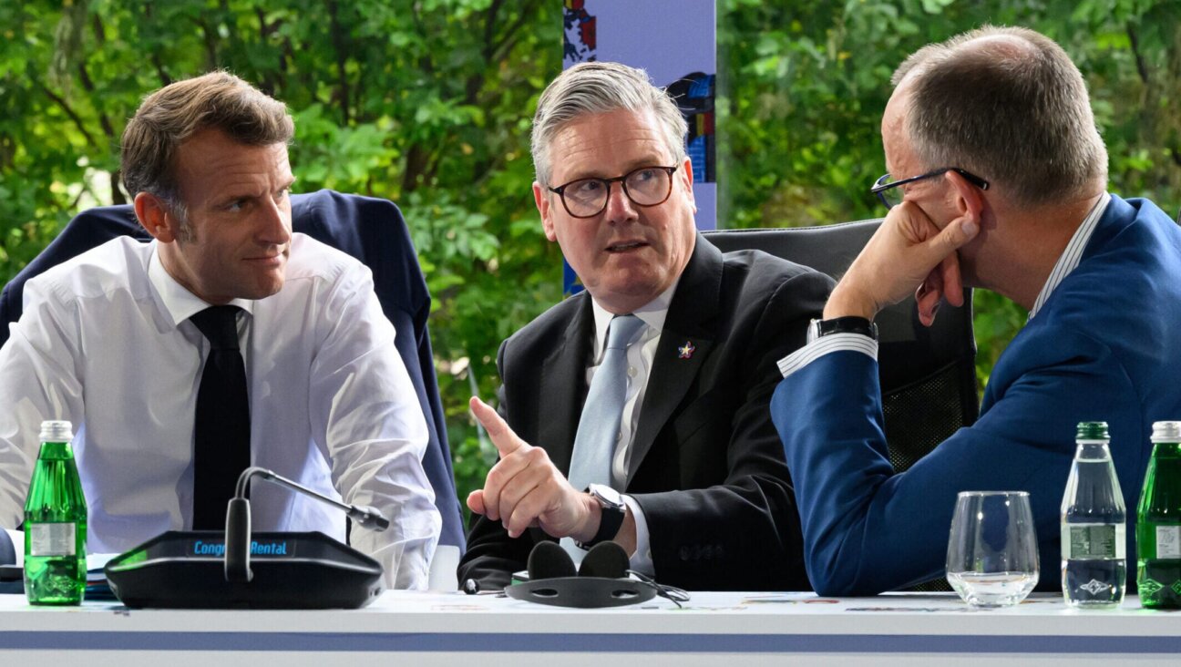 From L to R, France’s President Emmanuel Macron, Britain’s Prime Minister Keir Starmer and Germany’s Chancellor Friedrich Merz take part in a meeting during the European Political Community summit in Tirana, Albania, on May 16, 2025. (Leon Neal / Pool/AFP via Getty Images)
