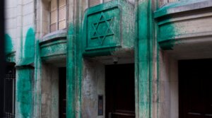 A photo shows green paint thrown on the walls of the Agoudas Hakehilos synagogue in Paris on May 31, 2025. The Shoah Memorial, two synagogues, and a restaurant in central Paris were sprayed with green paint overnight on May 30, 2025, according to police sources. (Photo by Magali Cohen / Hans Lucas / Hans Lucas via AFP via Getty Images)