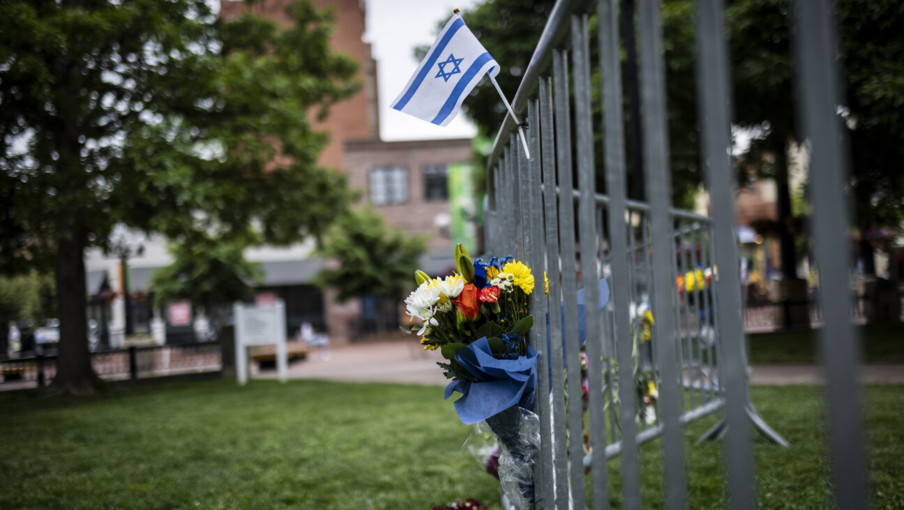 Flowers and a flag at the site of the attack outside the Boulder County Courthouse in Colorado.