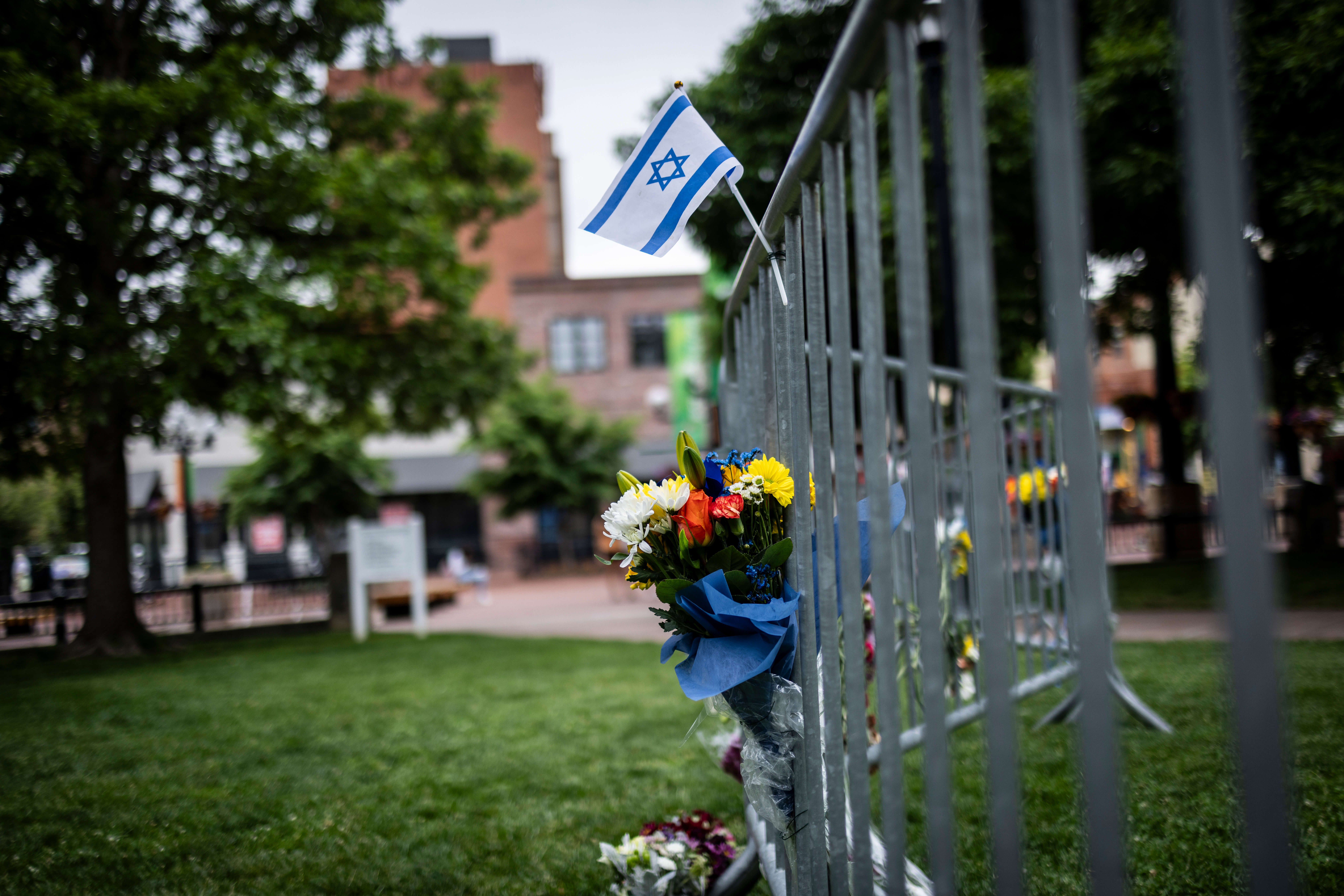 Flowers and a flag at the site of the attack outside the Boulder County Courthouse in Colorado.