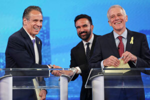 Democratic mayoral candidates Andrew Cuomo (L) shakes hands with Zohran Mamdani at a TV debate on June 4. 