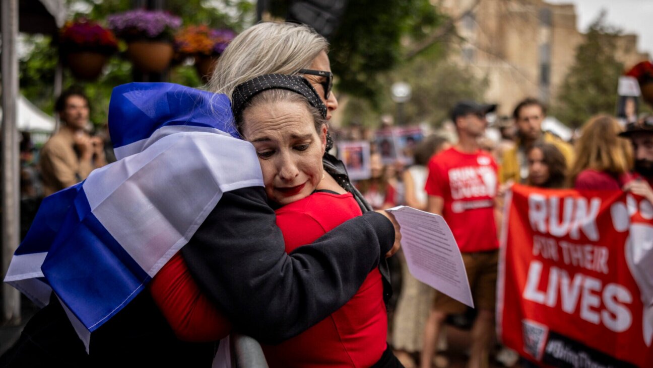 Rachel Amaru, an organizer for Run for Their Lives in Boulder, embraces Rachel Cohen, who was at the June 1 attack, on June 8, 2025, in Boulder, Colorado. 