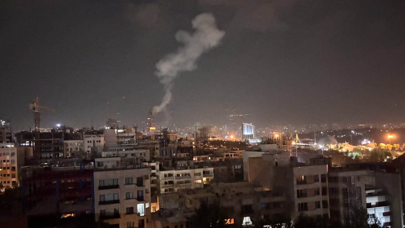 Smoke rises from a location allegedly targeted in Israel’s wave of strikes on Tehran, Iran, on early morning of June 13, 2025. (Photo by SAN/Middle East Images/AFP via Getty Images)