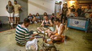 Israelis take shelter in a public underground facility during an Iranian ballistic missile barrage, June 14, 2025. 