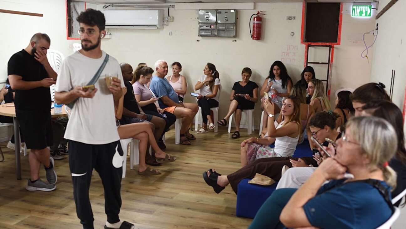 Israeli students take shelter inside a public bomb shelter during a ballistic missile barrage launched by Iran toward Israel at the Rupin Academic Centre, north of Tel Aviv, on June 17, 2025. 