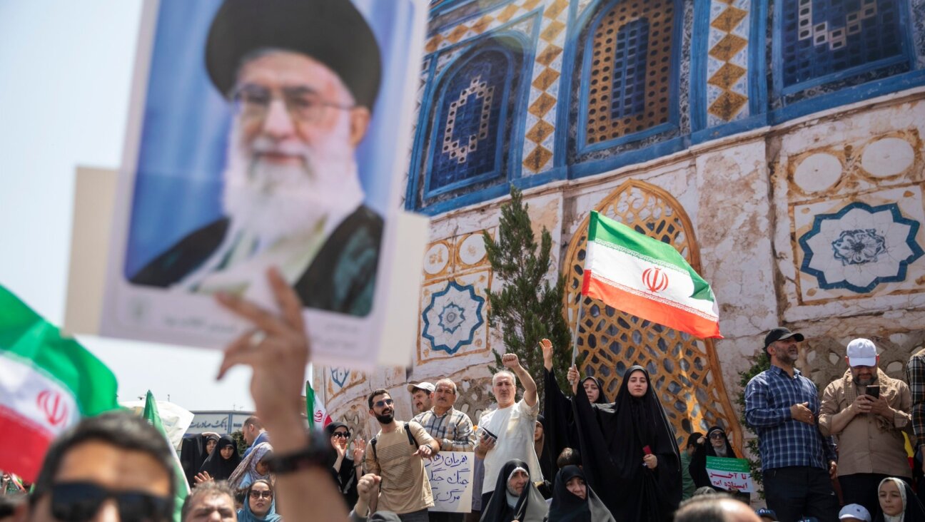 A demonstrator holds up a poster of Iran’s supreme leader, Ayatollah Ali Khamenei, during a protest against Israeli attacks on Iran, central Tehran, June 20, 2025.