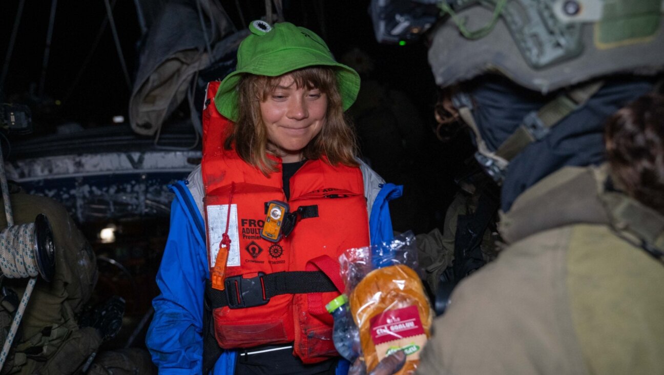 Israel’s foreign ministry released an image of Greta Thunberg being offered bread after her arrest at seat off the coast of Gaza, June 9, 2025. (Israeli Foreign Ministry handout)