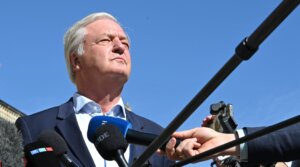 Jürgen Elsässer, editor-in-chief of the magazine “Compact”, is interviewed by journalists in front of the Federal Administrative Court in Leipzig. (Elisa Schu/picture alliance via Getty Images)