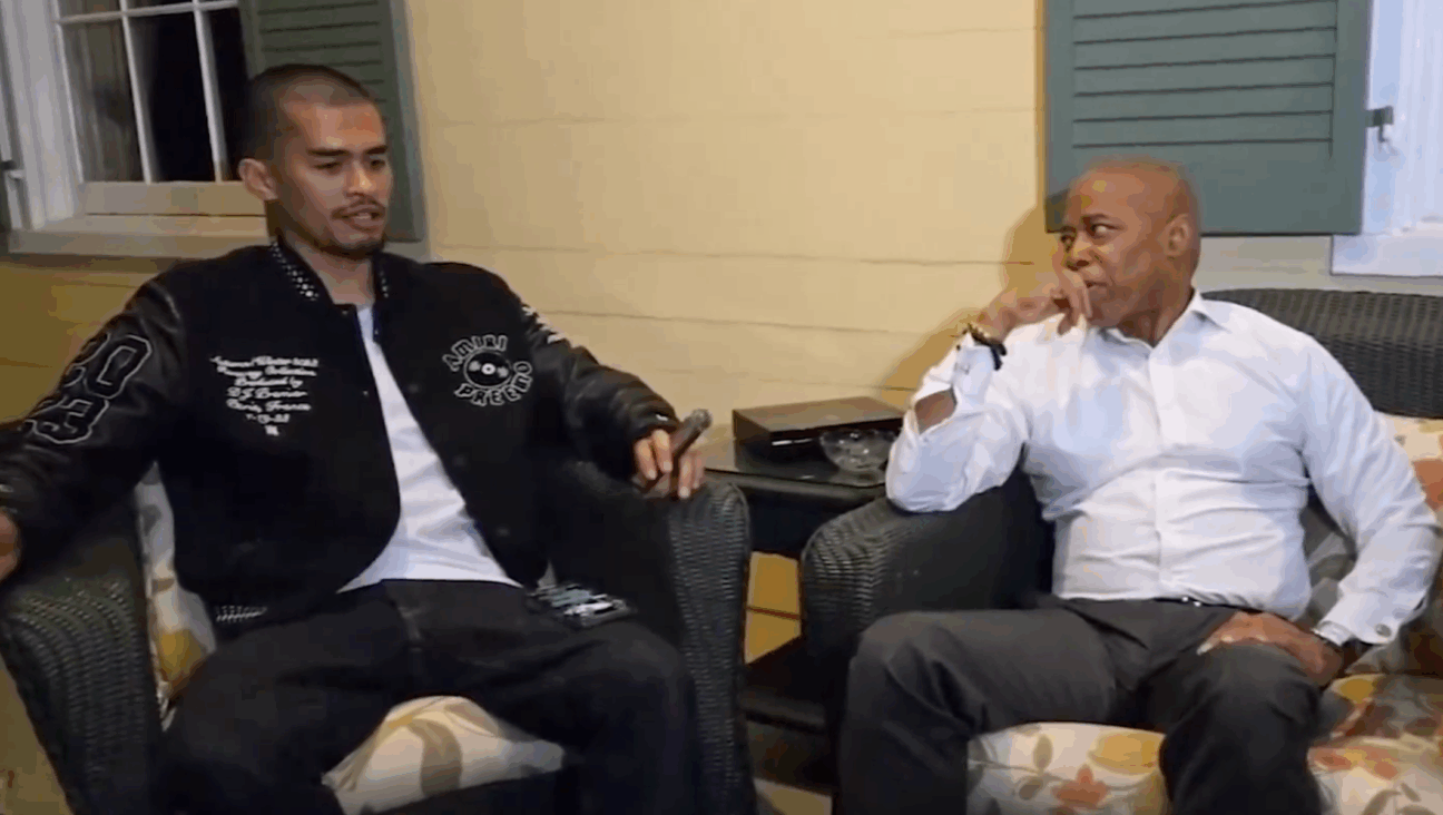 Antisemitic streamer Sneako and New York City Mayor Eric Adams smoke cigars at Gracie Mansion. (Screenshot)