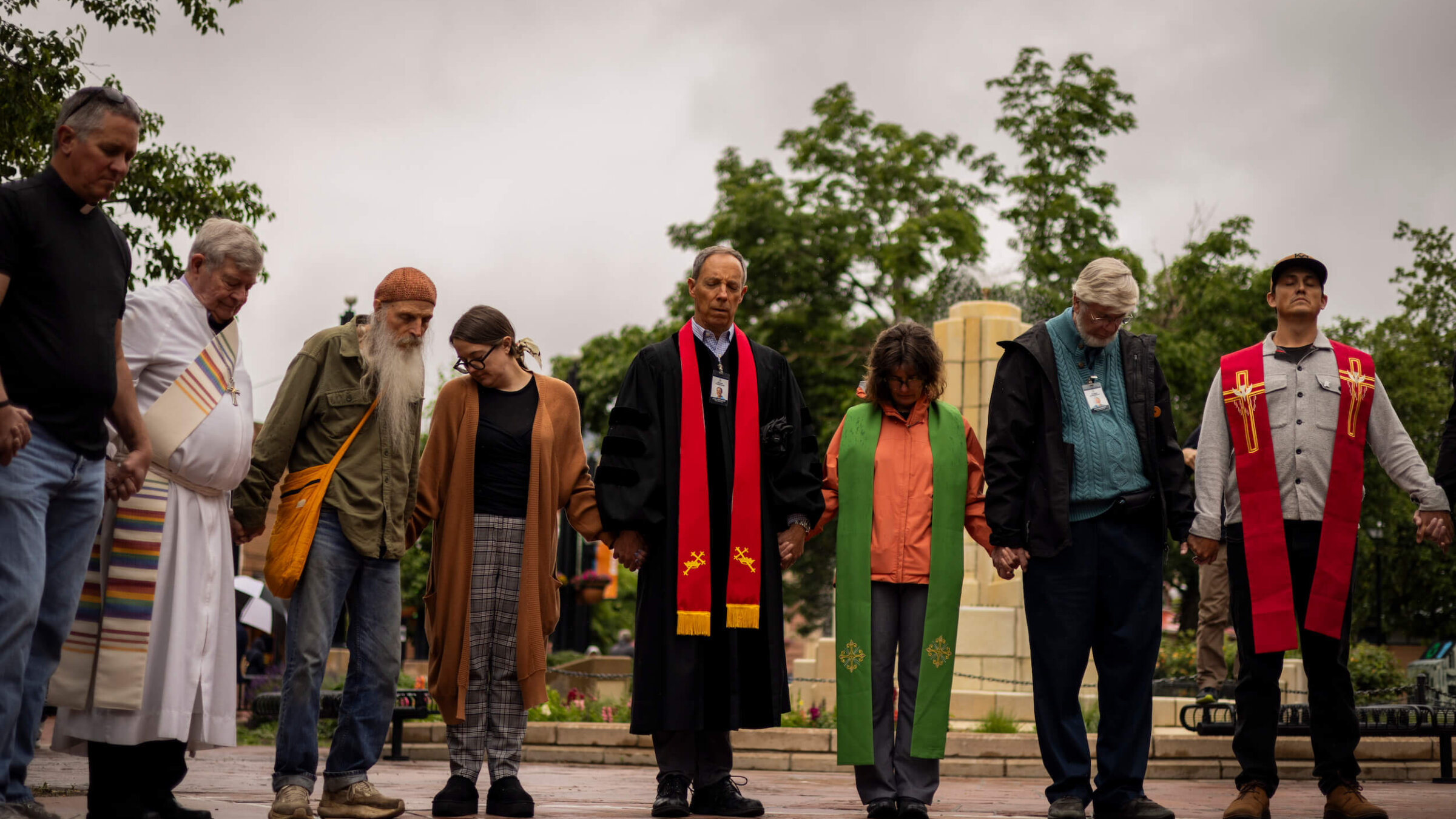 Local faith leaders and members of the community conduct a prayer vigil for the victims of a fire attack outside the Boulder County Courthouse on June 3 in Boulder, Colorado. 