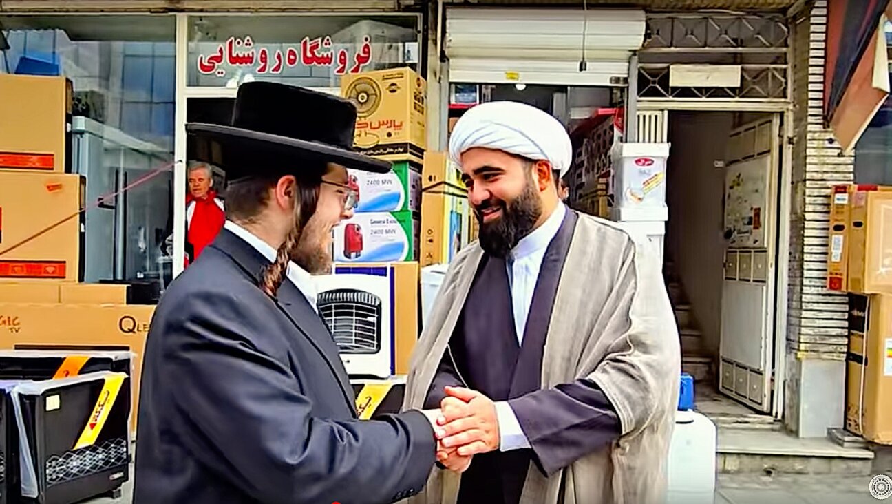 Abraham Schwartz meets an imam near the tombs of Queen Esther and Mordechai, in Hamedan