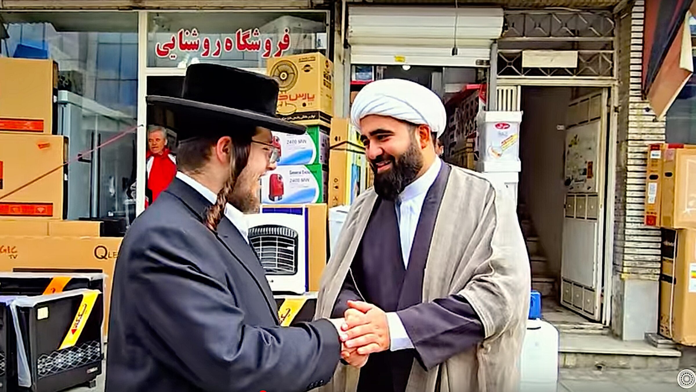 Abraham Schwartz meets an imam near the tombs of Queen Esther and Mordechai, in Hamedan