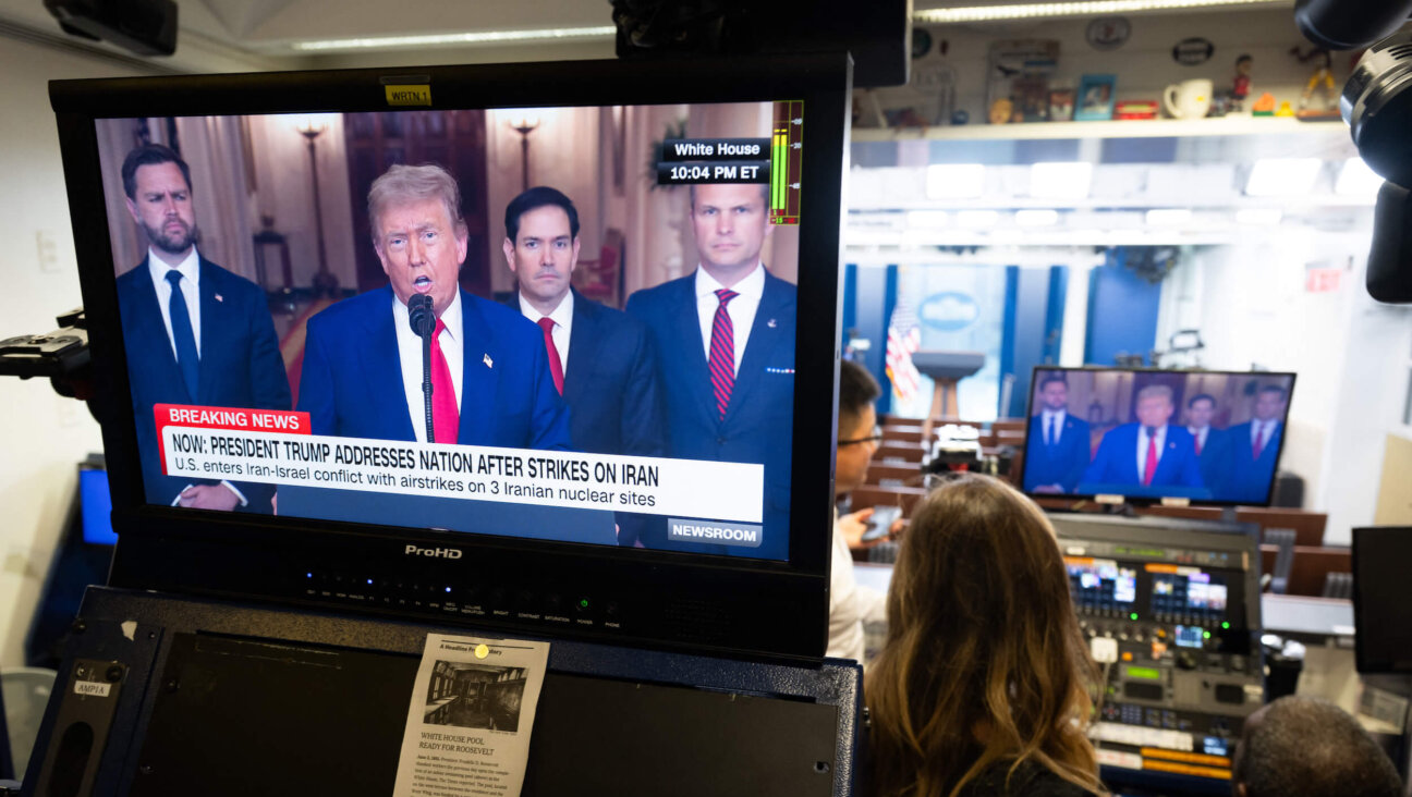 President Donald Trump addresses the nation regarding the US bombing of Iranian nuclear sites, as seen on a television screen in the Brady Press Briefing Room at the White House  on June 21. 