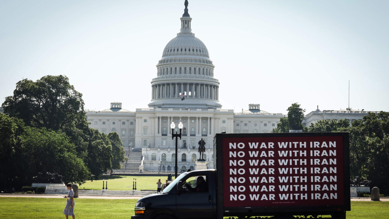 An electronic Billboard advocating for "No War With Iran" drives past the U.S. Capitol Building on June 19 in Washington, DC.