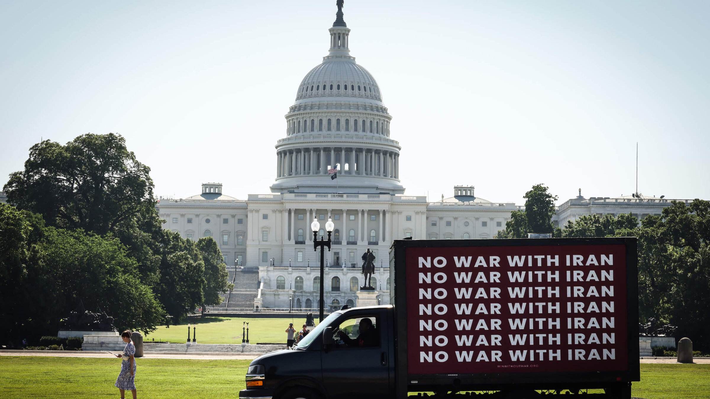 An electronic billboard advocating for "No War With Iran" drives past the U.S. Capitol Building June 19.