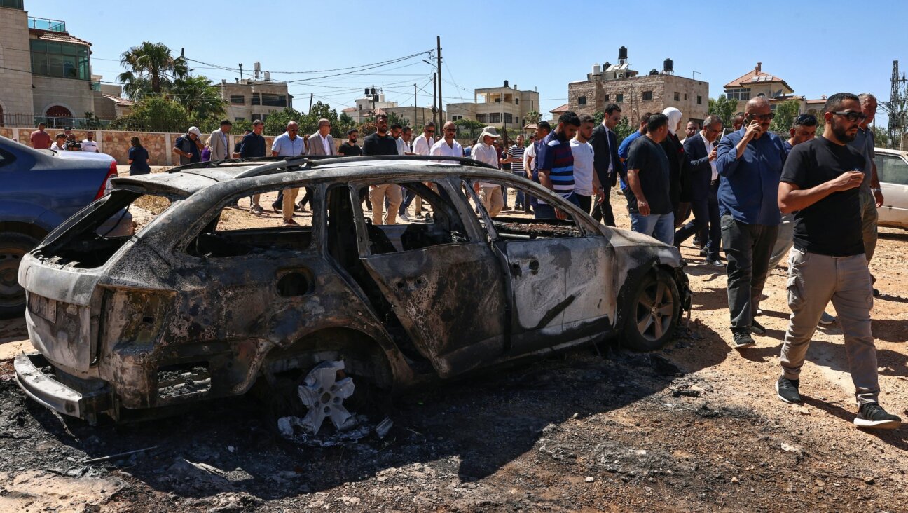 Members of a diplomatic delegation from the European Union inspect the damage at Kafr Malik village in the occupied West Bank on June 30, 2025, following an attack by Israeli settlers on June 25, 2025 during which three Palestinians were killed. (Zain Jaafar/AFP)