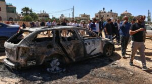 Members of a diplomatic delegation from the European Union inspect the damage at Kafr Malik village in the occupied West Bank on June 30, 2025, following an attack by Israeli settlers on June 25, 2025 during which three Palestinians were killed. (Zain Jaafar/AFP)