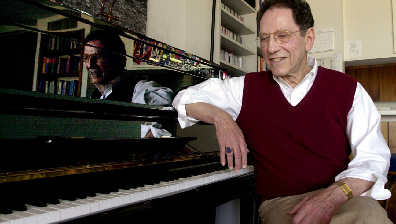 Tom Lehrer sits beside the piano in his house in Santa Cruz, Calif., on April 21, 2000. 