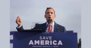Max Miller speaks at a  Trump rally in 2021. 