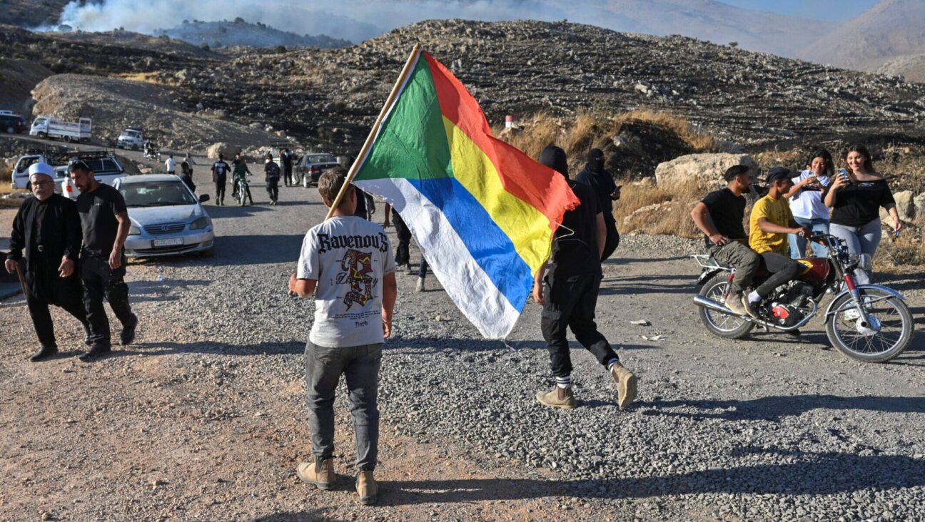 Druze residents protest near the Israeli-Syrian border fence in solidarity with their community in Syria, July 16, 2025. (Michael Giladi/Flash90)