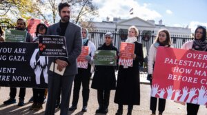 Actor and activist Cynthia Nixon, third from right, listens to New York State Rep. Zohran Mamdani (D), speak during a news conference outside the White House to announce a hunger strike to demand that President Joe Biden “call for a permanent ceasefire and no military aid to Israel,” on Nov. 27, 2023. (Tom Williams/CQ-Roll Call, Inc via Getty Images)