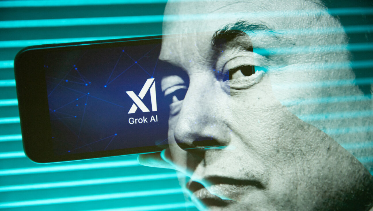 Double exposure photograph of a portrait of elon musk and a person holding a telephone displaying the Grok artificial intelligence logo.