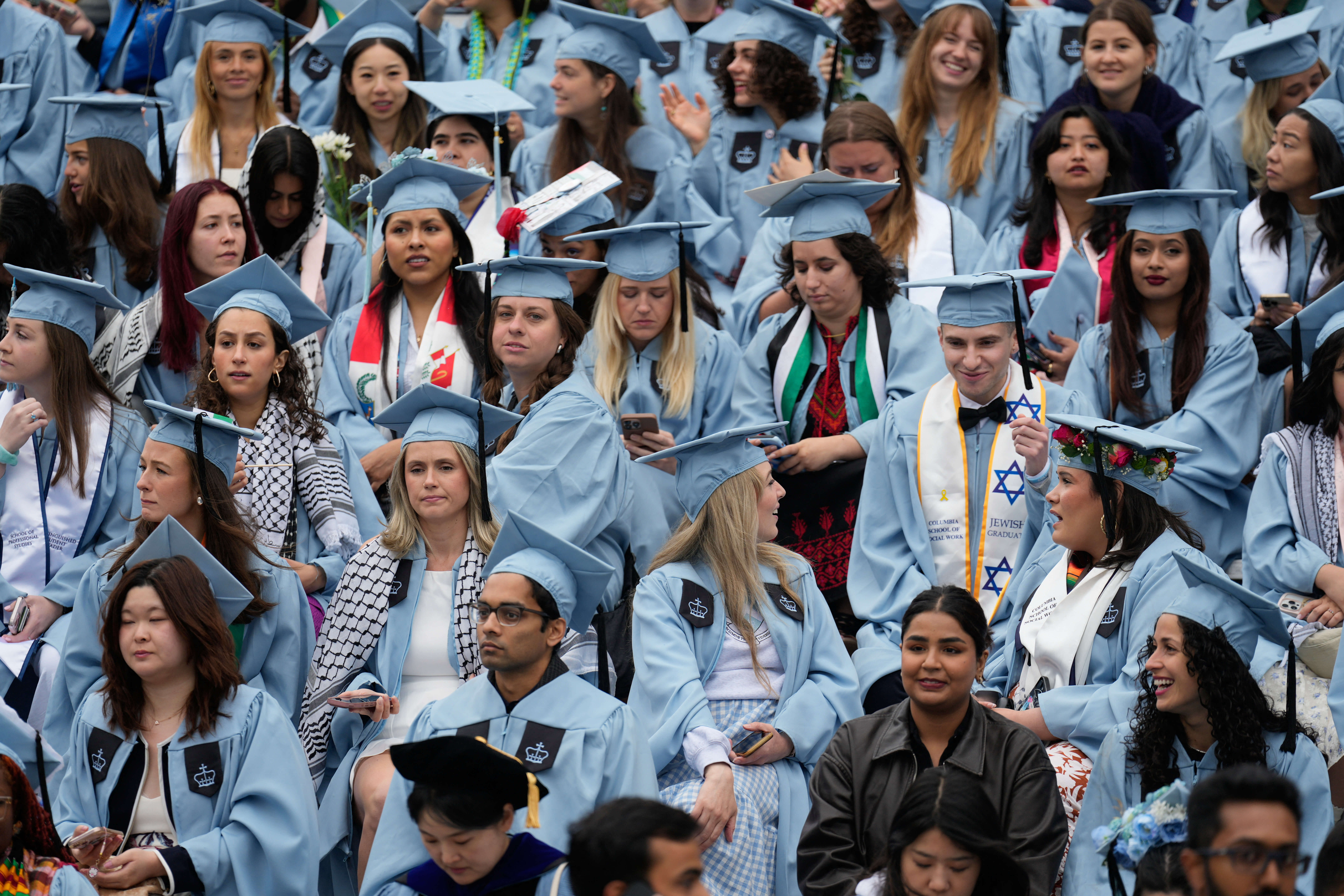 Students look on during the Commencement Ceremony at Columbia University in New York on May 21, 2025.