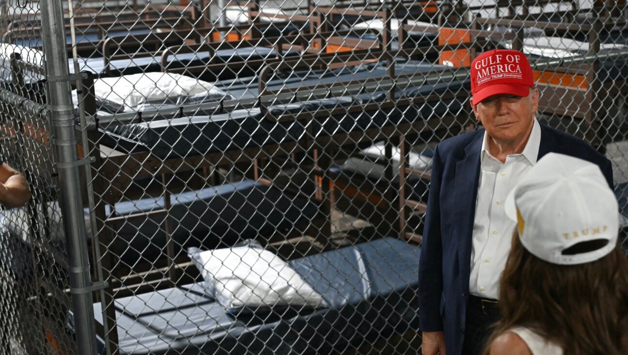 President Donald Trump speaks with Secretary of Homeland Security Kristi Noem as they tour a migrant detention center, dubbed “Alligator Alcatraz,” in Ochopee, Florida, July 1, 2025.