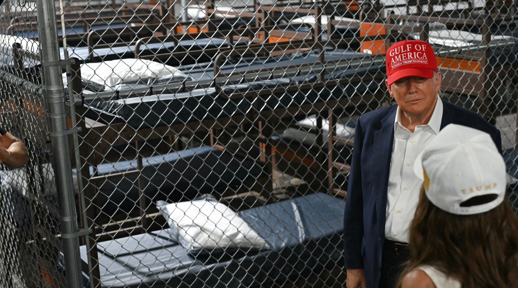 President Donald Trump speaks with Secretary of Homeland Security Kristi Noem as they tour a migrant detention center, dubbed “Alligator Alcatraz,” in Ochopee, Florida, July 1, 2025.