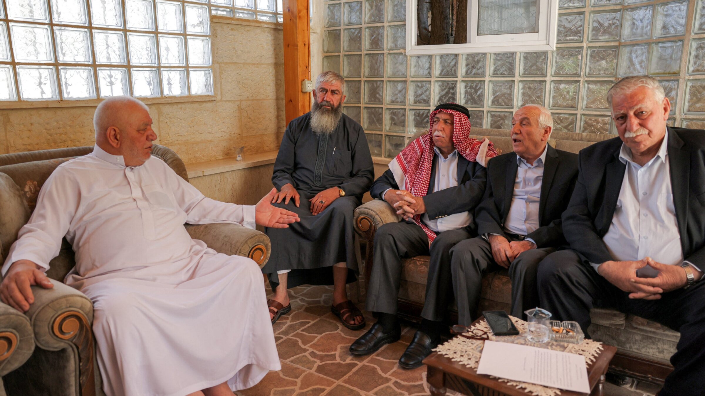 Aref al-Jaabari (2nd-R), former governor of Hebron and head of the Jaabari family in the area, attends a meeting with elders of the Jaabari family to deny media reports it was ready to break off from the Palestinian Authority and sign a peace deal with Israel as a separate emirate, in Hebron in the occupied West Bank on July 6, 2025. (Photo by HAZEM BADER / AFP) (Photo by HAZEM BADER/AFP via Getty Images)