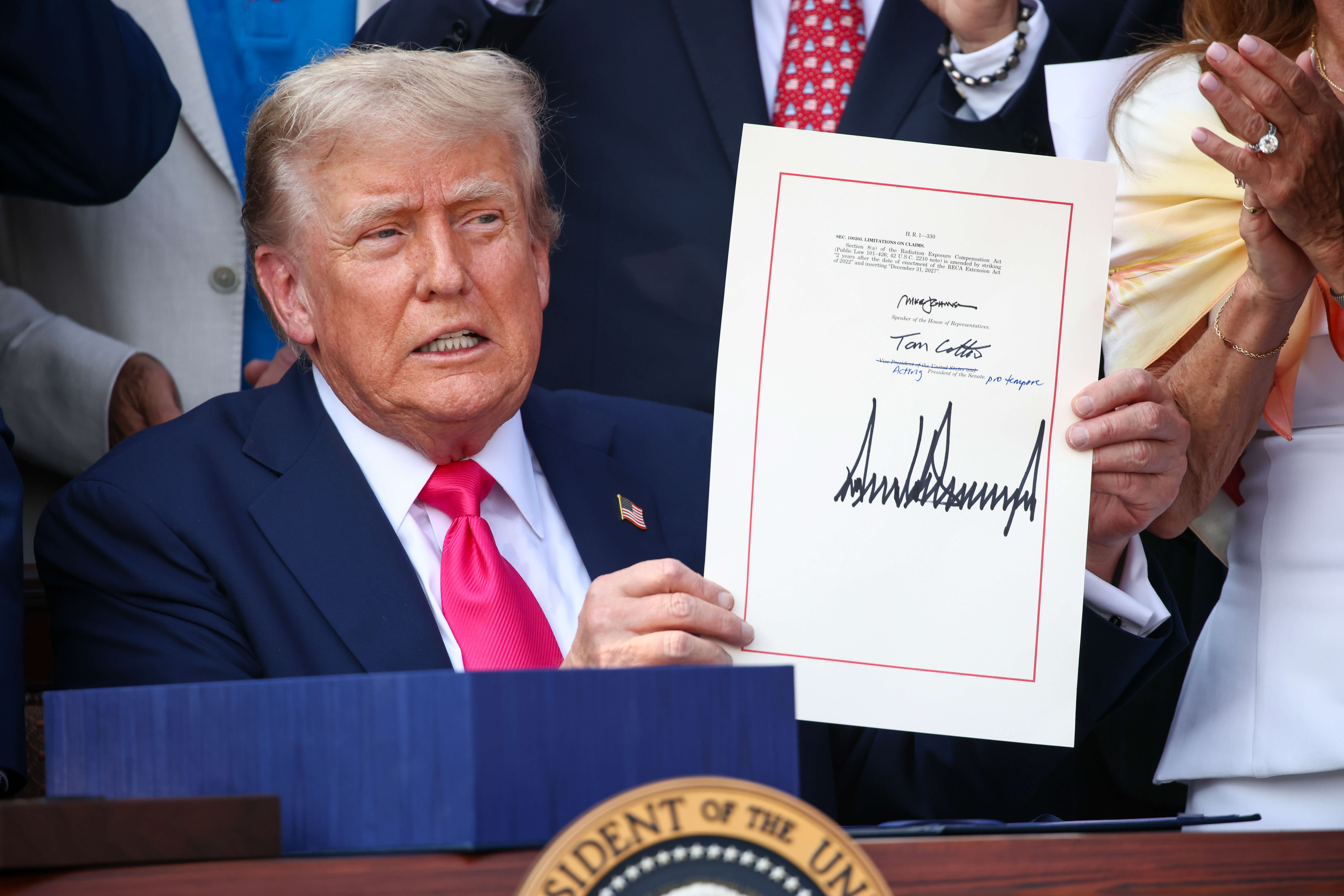 President Donald Trump signs the One Big Beautiful Bill Act into law on July 4.