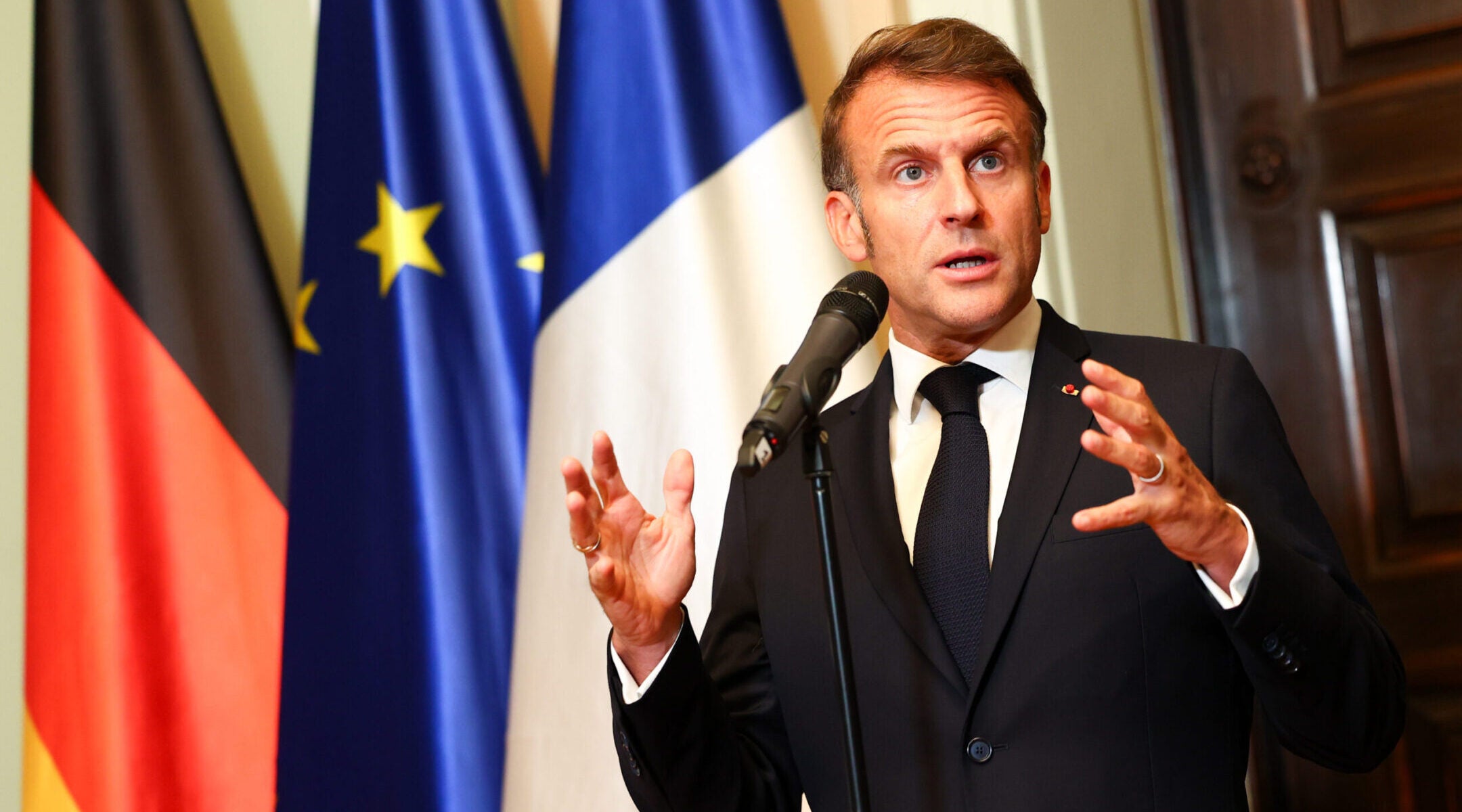 French President Emmanuel Macron talks to media in Berlin on July 23, 2025. 