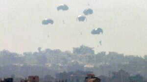 Humanitarian aid is dropped on the Gaza Strip as pictured from a position along the border in southern Israel on July 27, 2025.