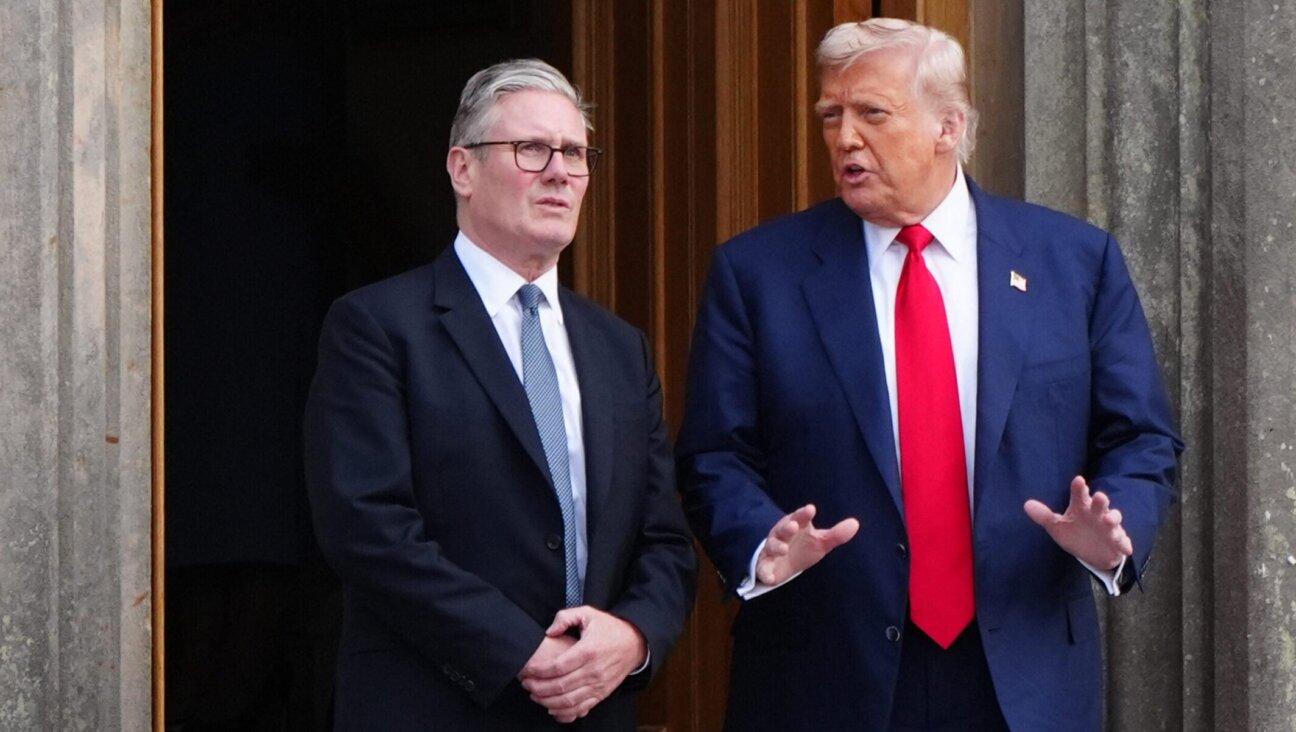 President Donald Trump and Britain’s Prime Minister Keir Starmer pose at Trump MacLeod House & Lodge Trump in Scotland, on July 28, 2025.