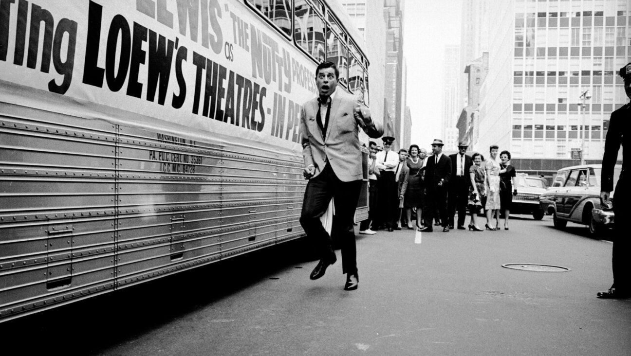 American comedian and actor Jerry Lewis pretends to run from adoring fans during the promotional tour for the film “The Nutty Professor,” directed by and starring Lewis, in 1963. (Arthur Schatz/Getty Images)