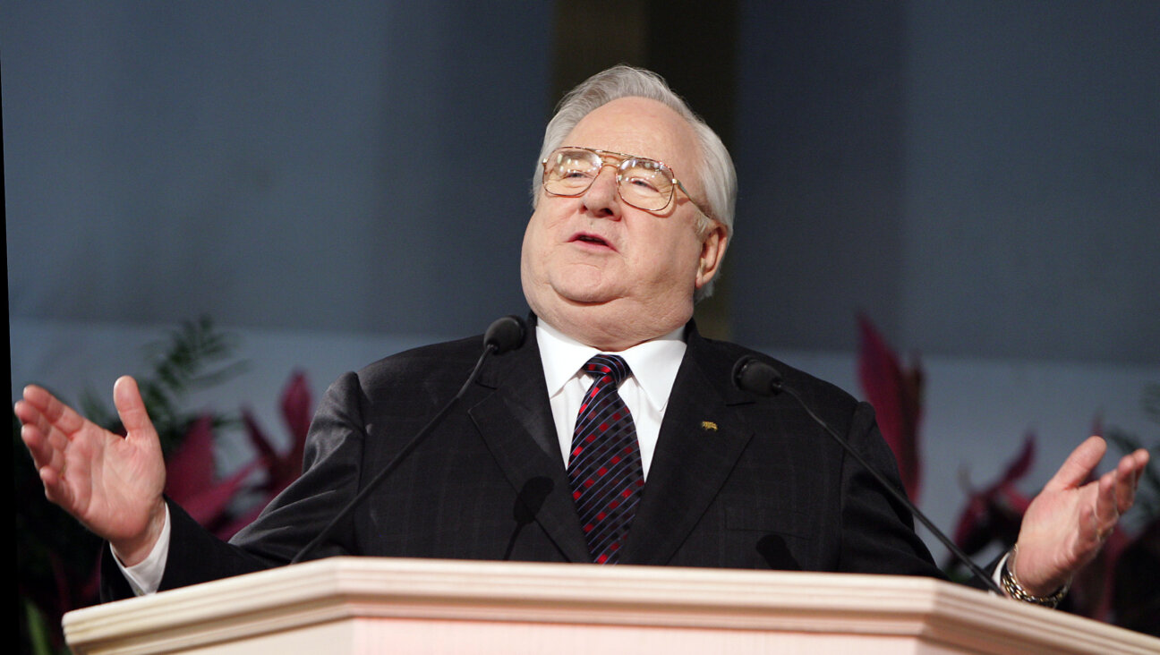 Jerry Falwell Sr., speaking at a politically inflected rally in 2006 from a stand engraved with a cross — but apparently not orating in his capacity as a pastor, legally speaking.