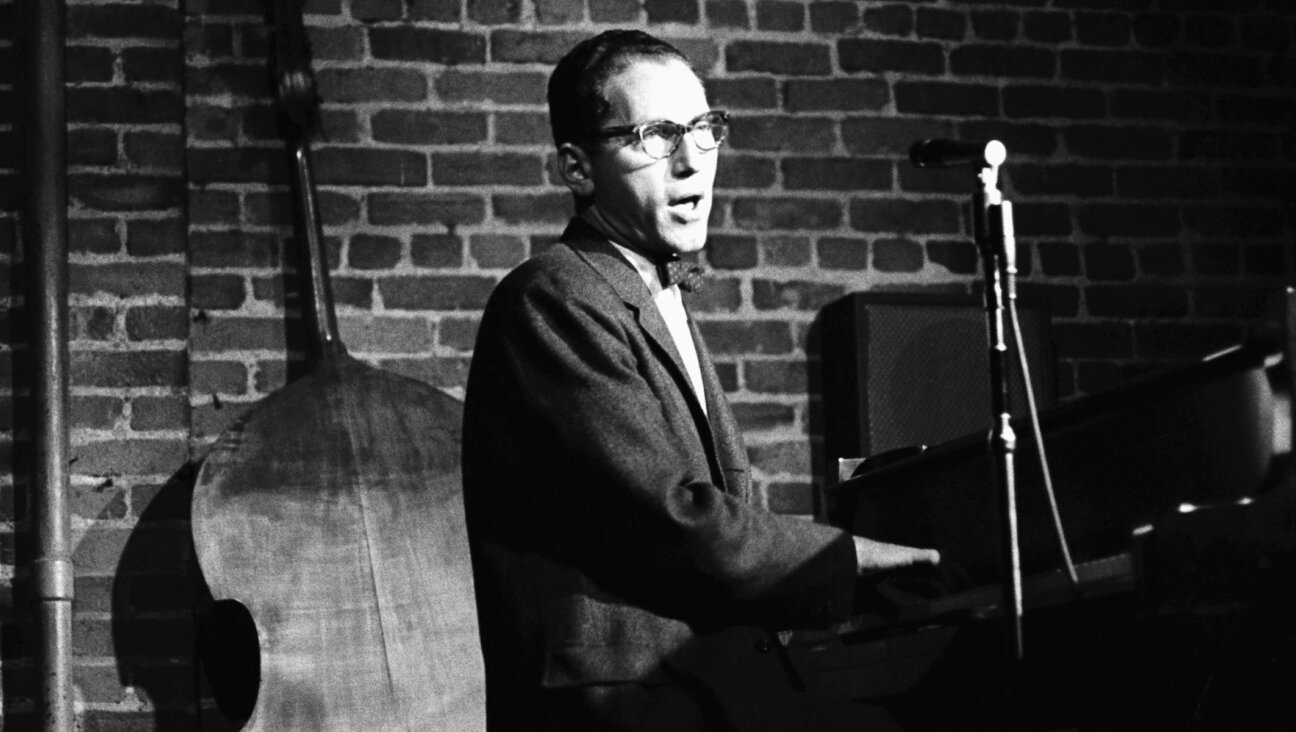Tom Lehrer sings and plays piano at the Hungry I Nightclub in San Francisco.