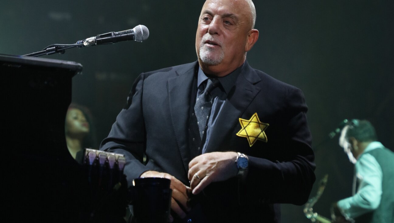 Billy Joel wears a jacket with the Star of David during the encore of his 43rd sold out show at Madison Square Garden on August 21, 2017 in New York City.  