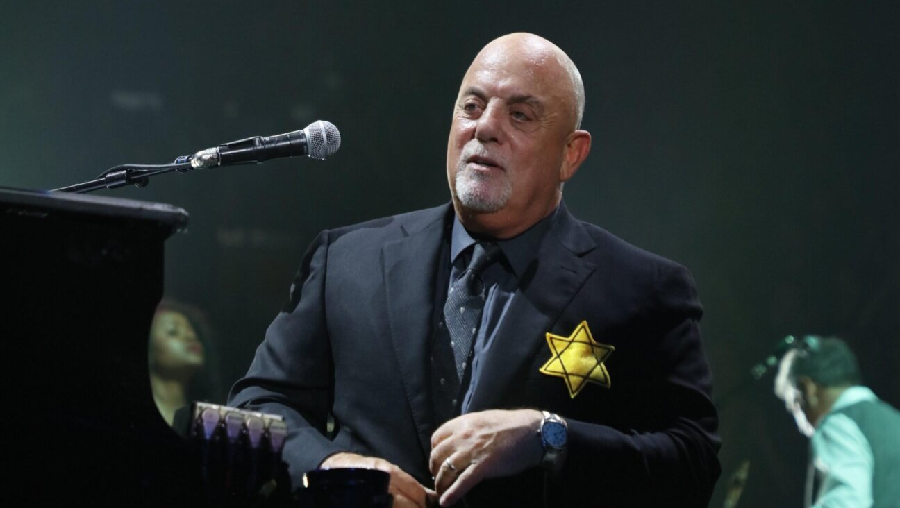 Billy Joel wears a jacket with the Star of David during the encore of his 43rd sold out show at Madison Square Garden on August 21, 2017 in New York City.  