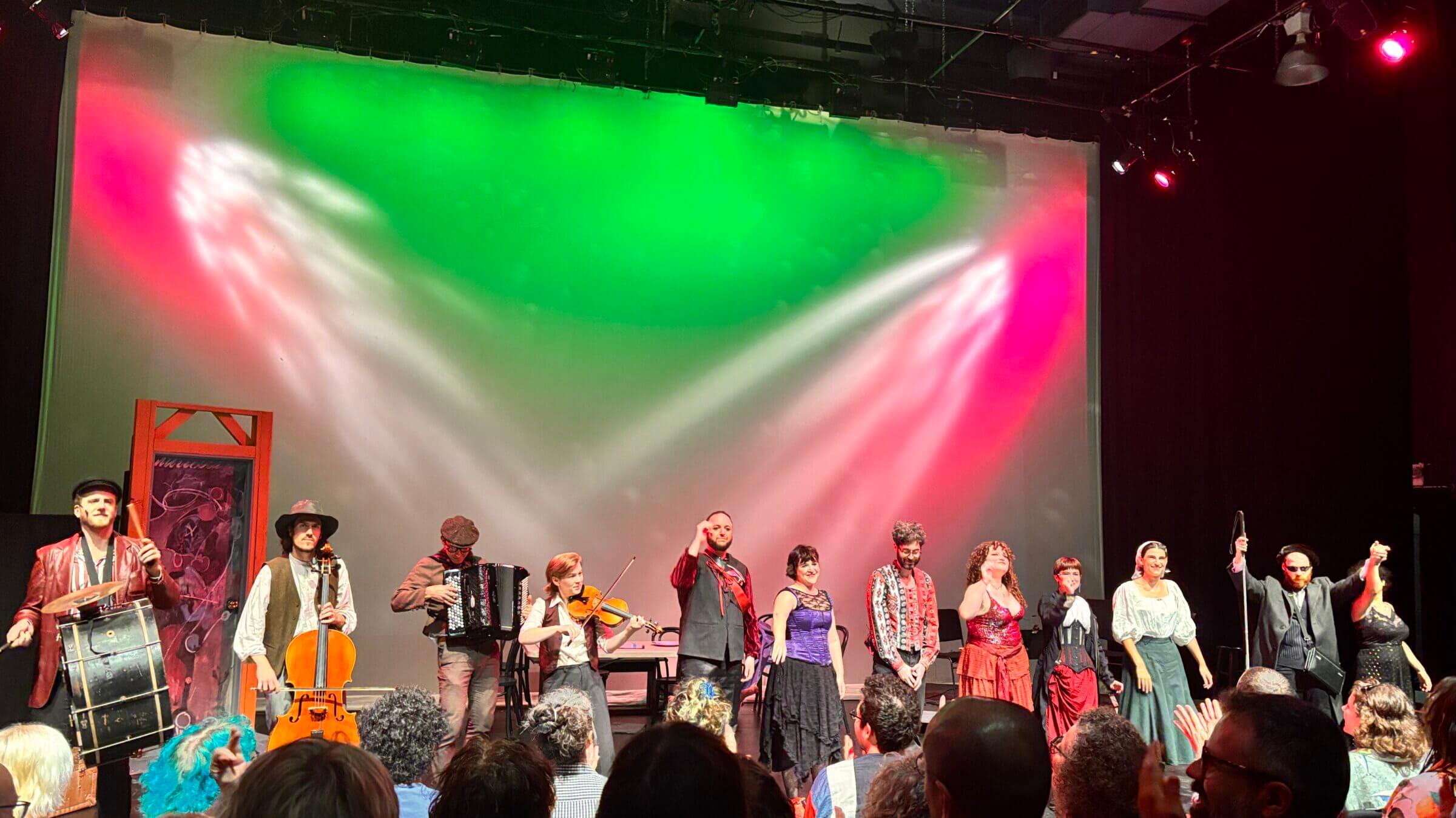 The cast of "Feast of the Seven Sinners" lines up at curtain call.