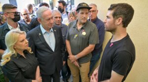 Israeli Prime Minister Benjamin Netanyahu speaks with American-Israeli released hostage Sagui Dekel-Chen during his visit to Kibbutz Nir Oz on July 3, 2025. (Photo by Kobi Gideon/GPO)