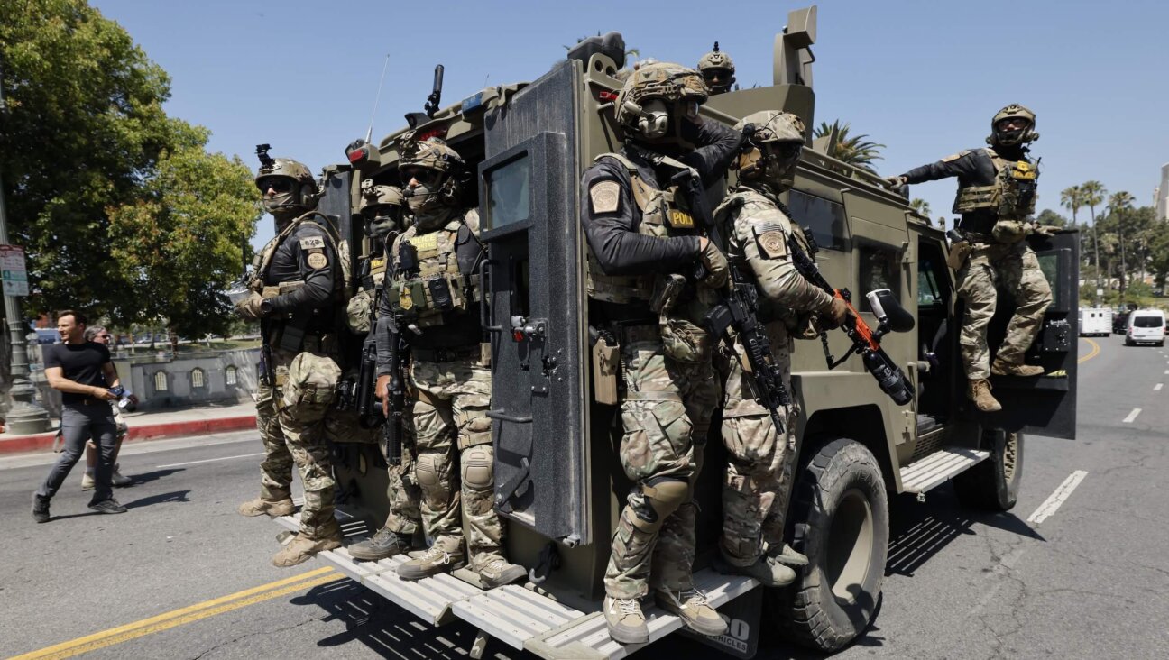 Federal immigration agents near MacArthur Park in the Westlake area of Los Angeles on July 7. 
