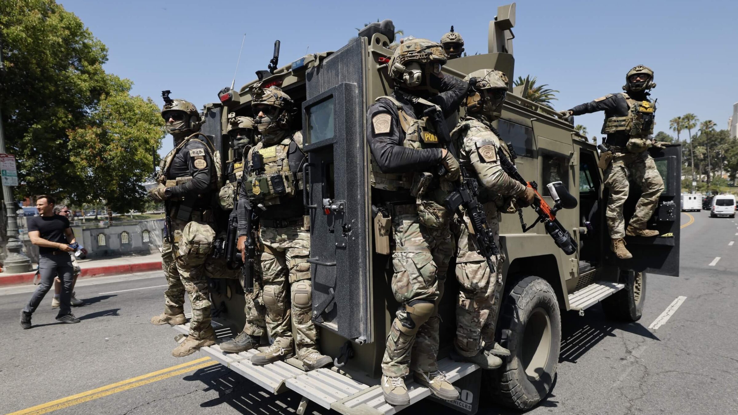 Federal immigration agents near MacArthur Park in the Westlake area of Los Angeles on July 7. 