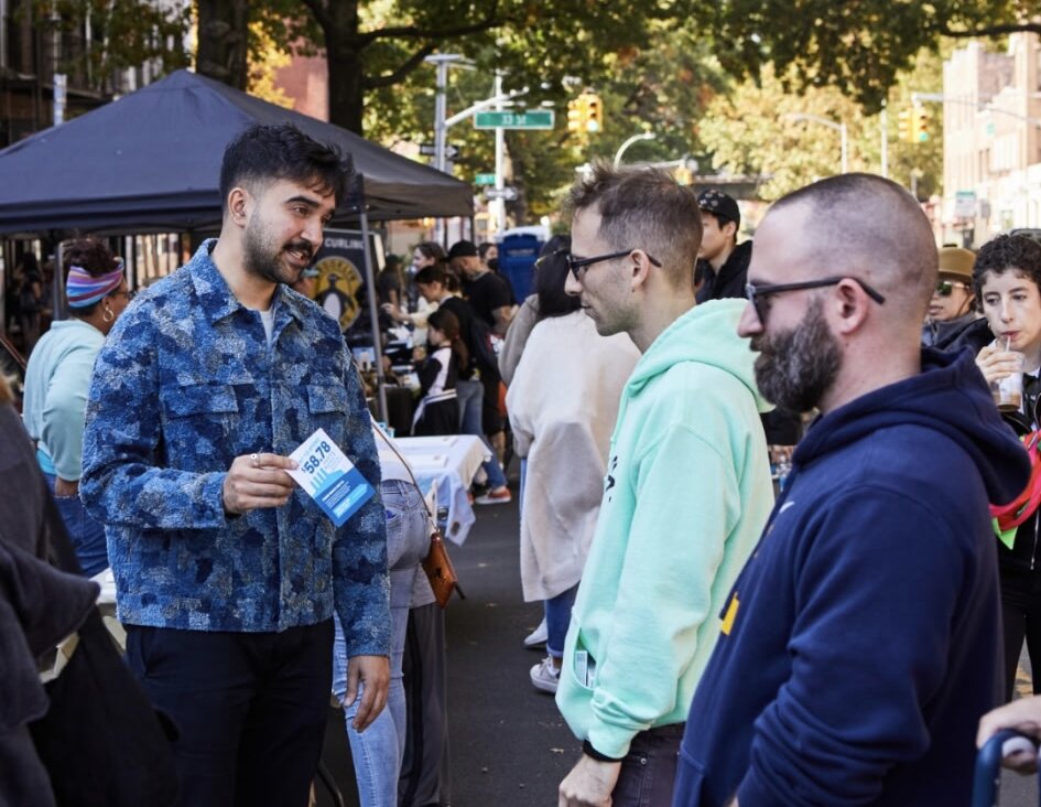 Zohran Mamdani talked with constituents at the 2022 block party organized by Tikkun BBQ on 31st Avenue in Astoria.