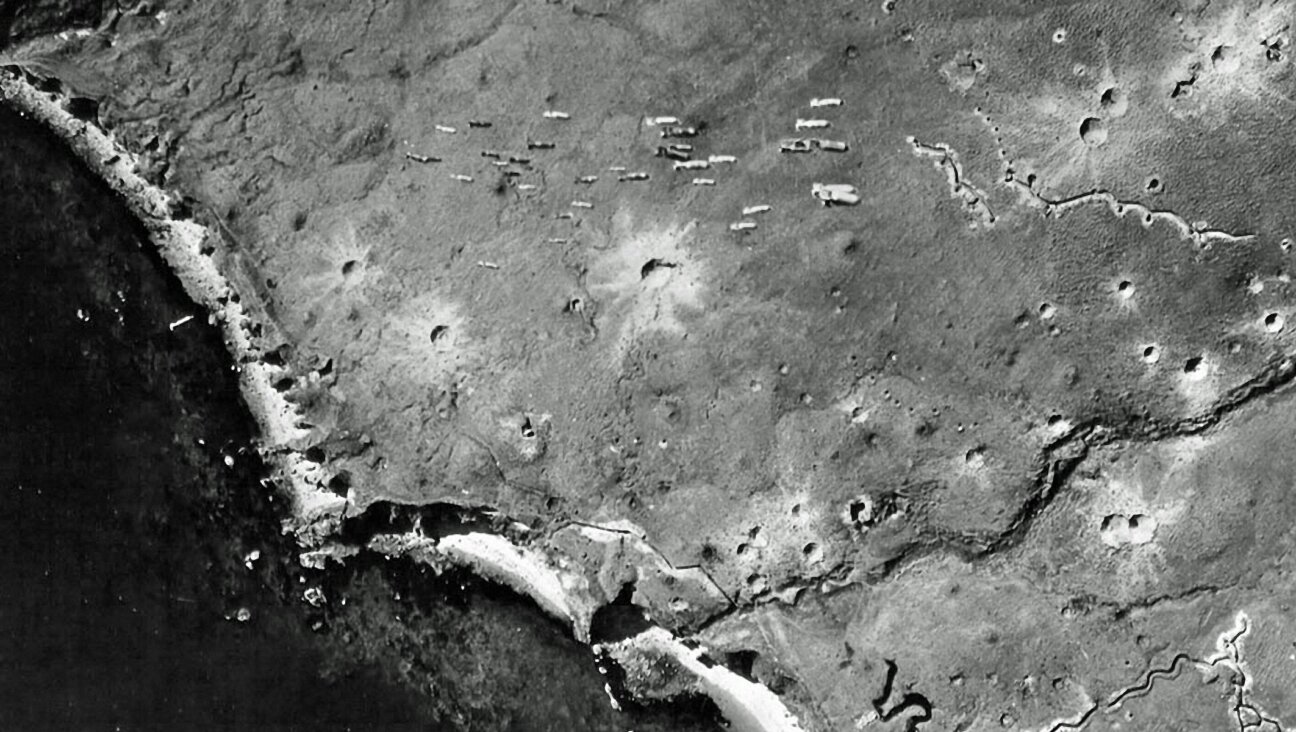 Dozens of bombs fall from a U.S. bomber toward Japanese-occupied Kiska Island, Aleutian Islands on August 10, 1943. (Galerie Bilderwelt/Getty Images)